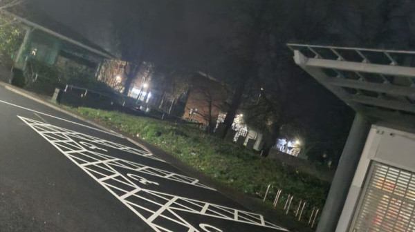 Freshly marked parking bays and pedestrian routes in a retail car park.