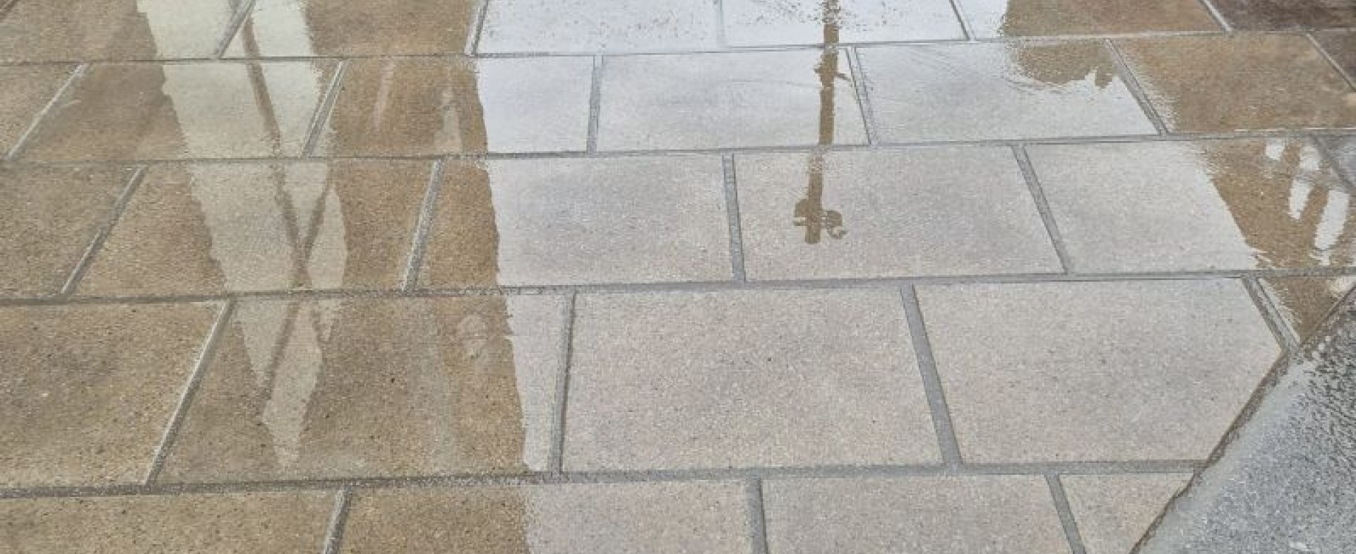Reinstated urban road and paving surfaces carefully matched to the surrounding streetscape after utility works.