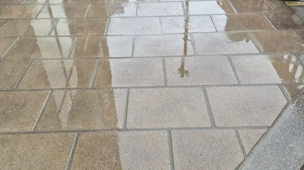 Urban road and paving reinstatement completed following utility works.
