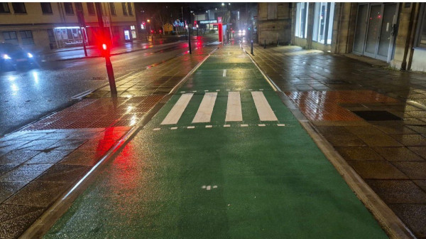 High-visibility cycle lane markings installed in Bradford using MMA and thermoplastic materials.