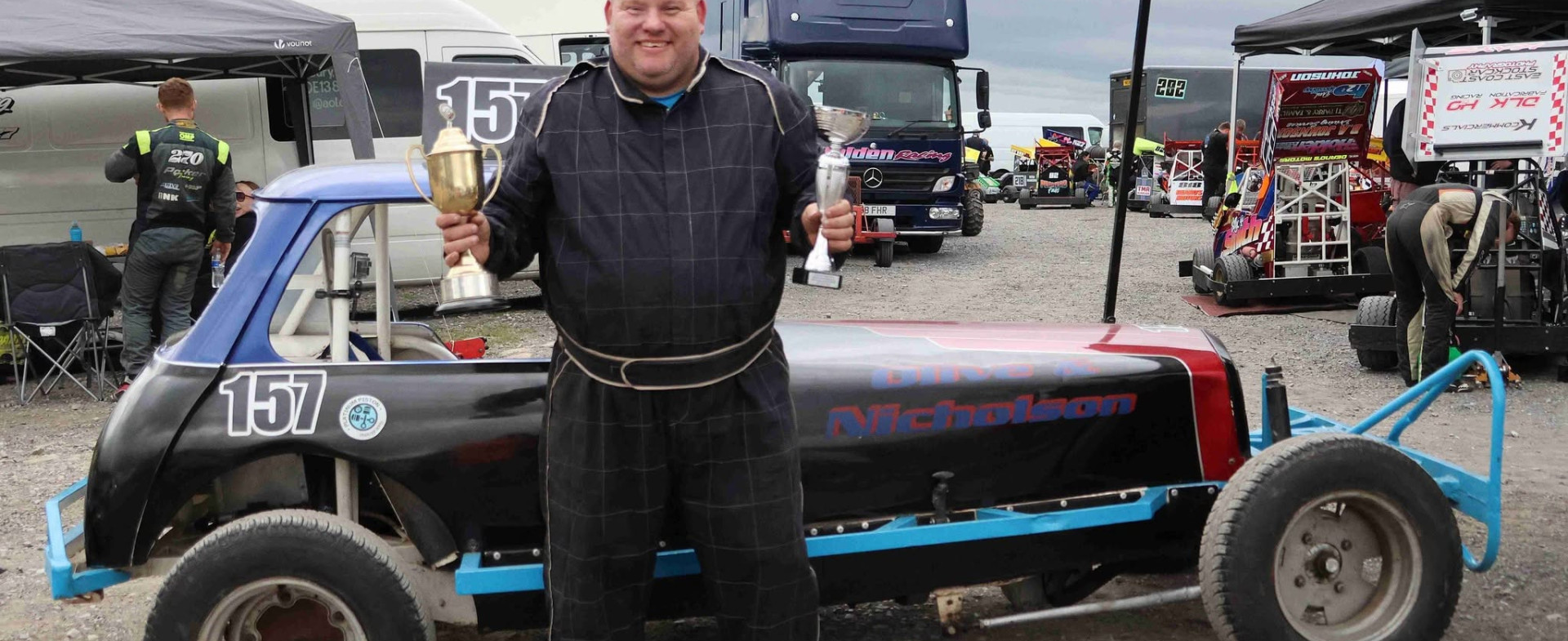 Jointline Airfields and Civils Contracts Manager Kevan Woollas with his Heritage Formula 2 stock car after winning the BriSCA Heritage Formula 2 Championship.